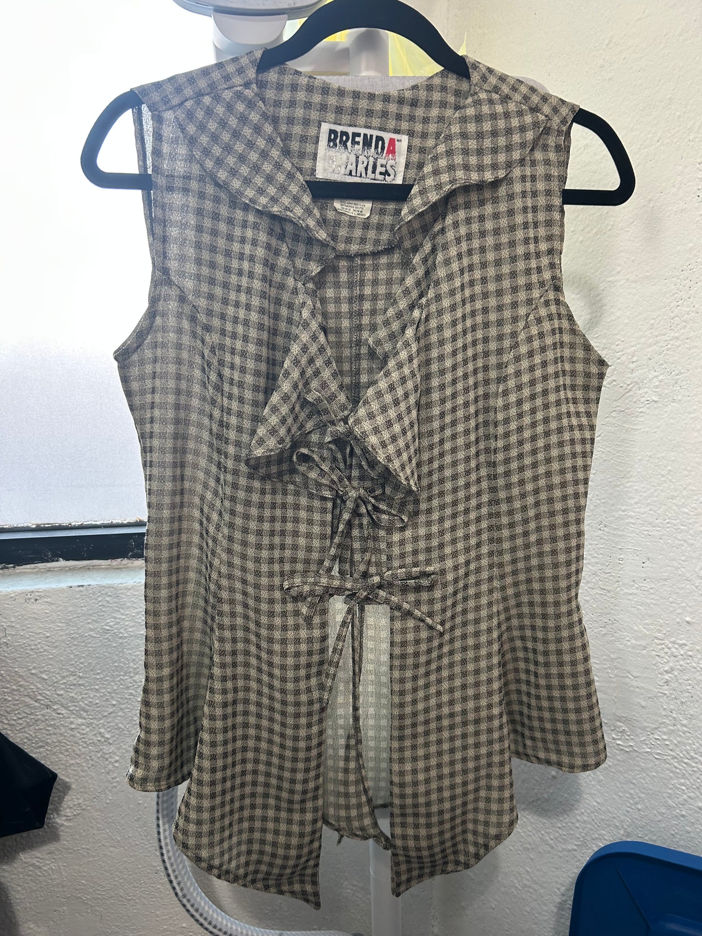 Blusa de cuadritos con moñitos